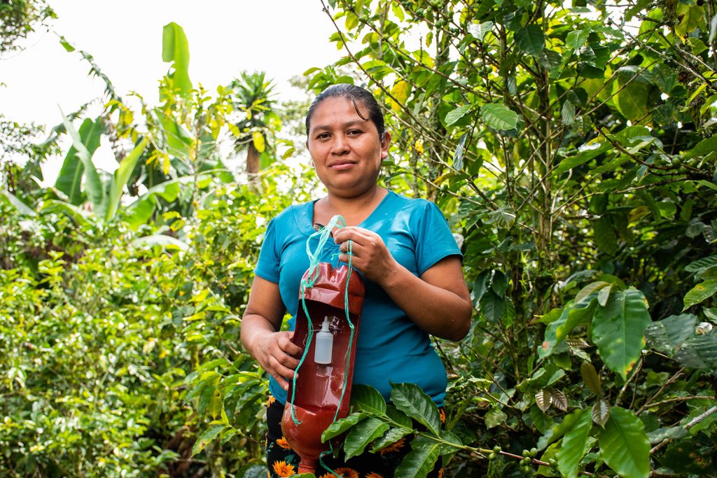 Blanca stands in a field in Guatemala.